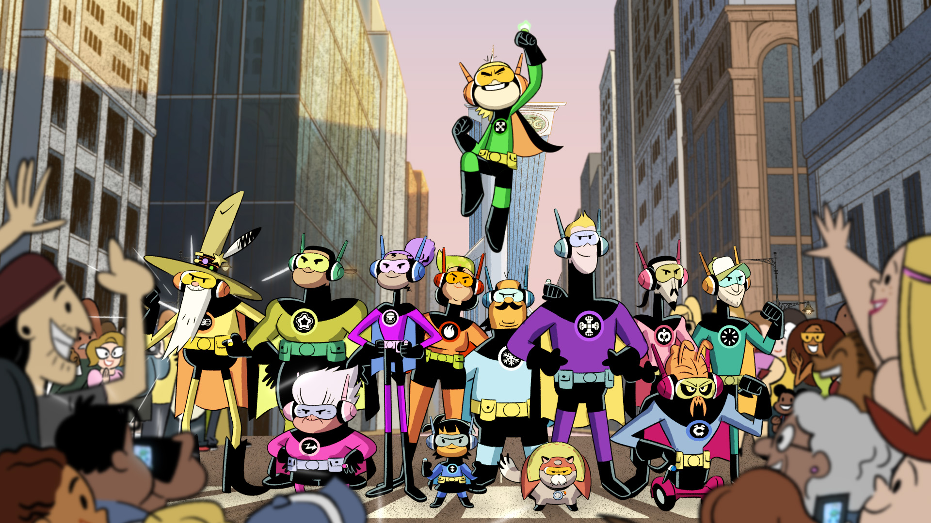 The characters from Kid Cosmic are wearing superhero outfits as they stand with other people dressed as heroes in the city street as a crowd cheers.