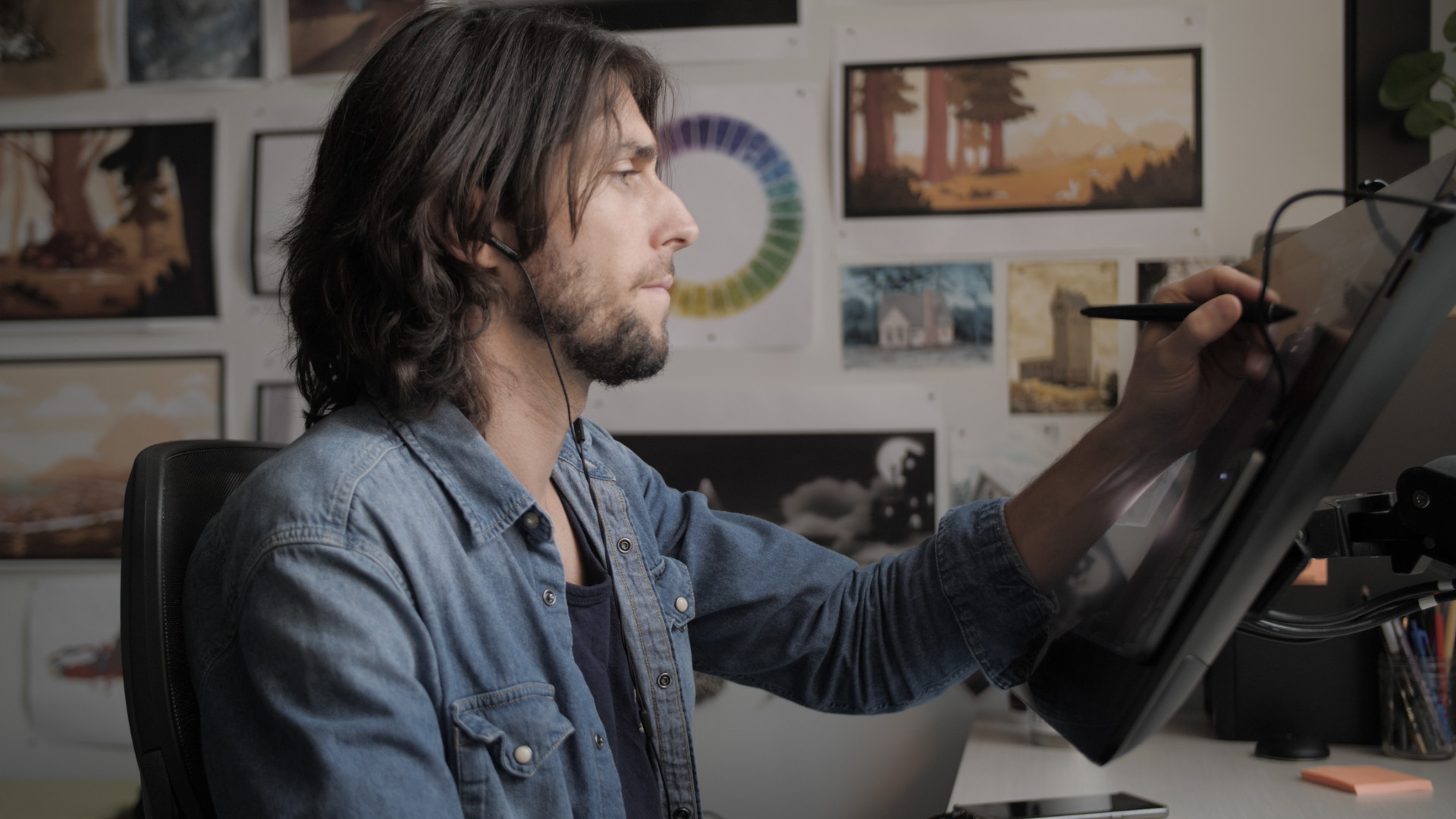An animator draws on his cintiq in his office at Mercury Filmworks.